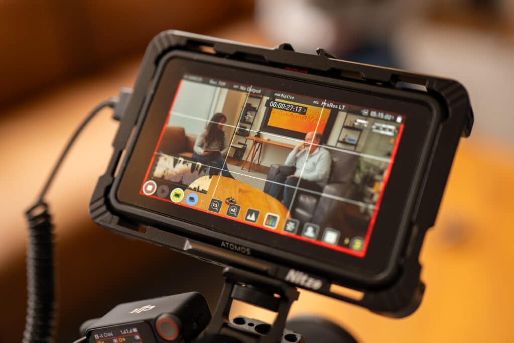 View of the camera monitor as it records Danny and Suze