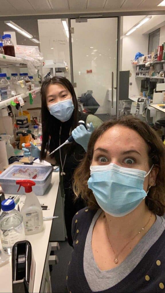 Hui with a colleague in the lab