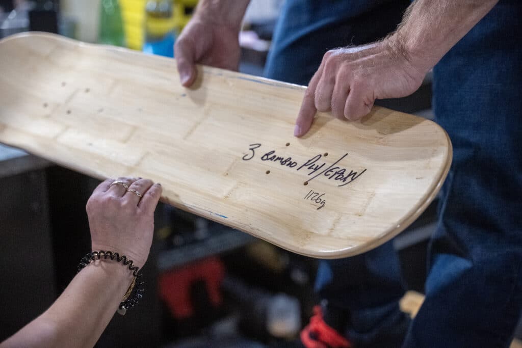 Rodney Mullen holding a skateboard deck