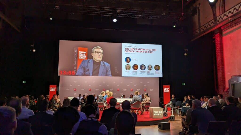 Photo of Henning Schoenenberger in panel session at Falling Walls