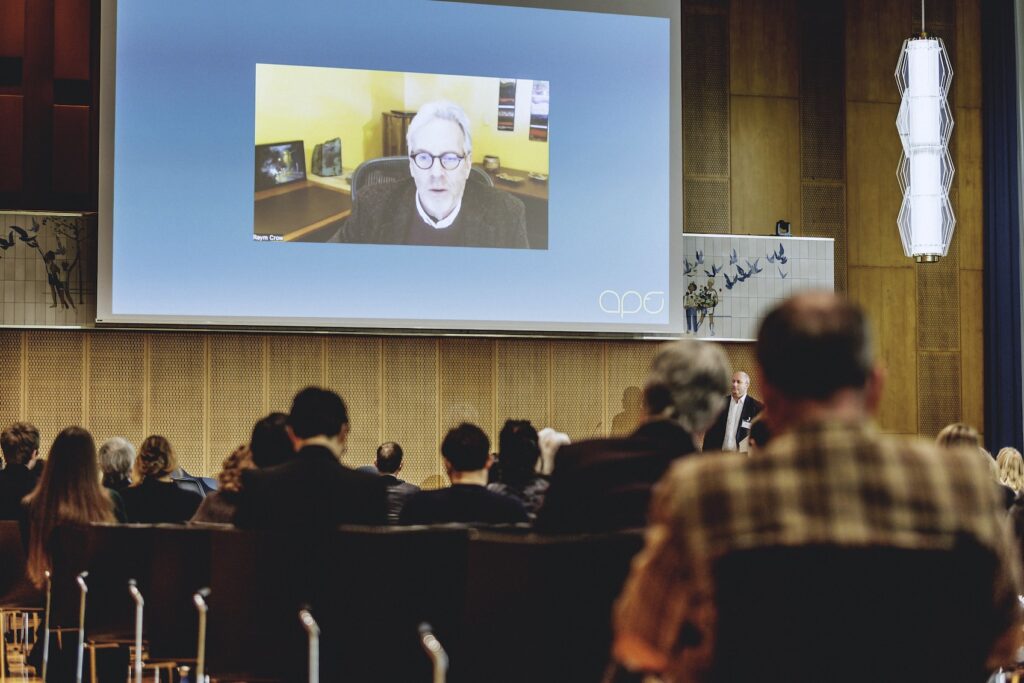 Dr Raym Crow speaking at conference