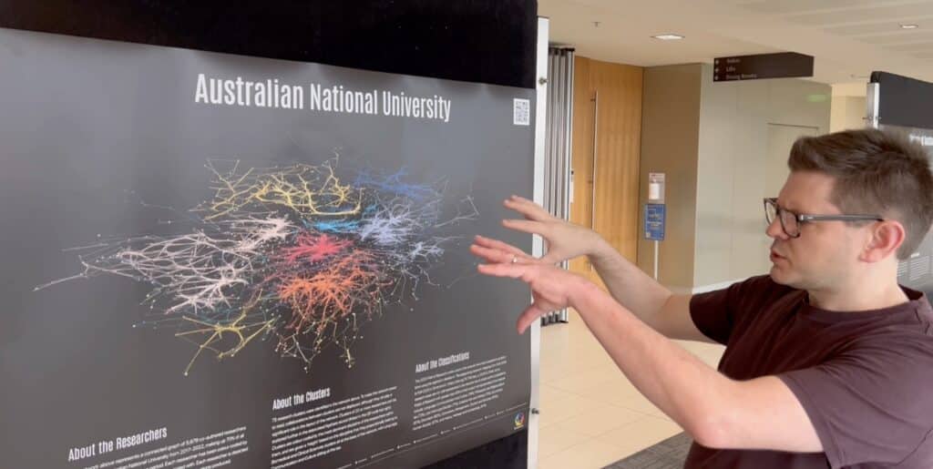 Simon explaining graphical representation of the research from Australian National University