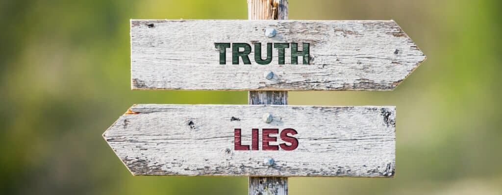 pic showing two signs saying truth and lies respectively